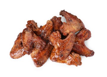 Photo of Pile of chicken wings glazed with soy sauce isolated on white, top view