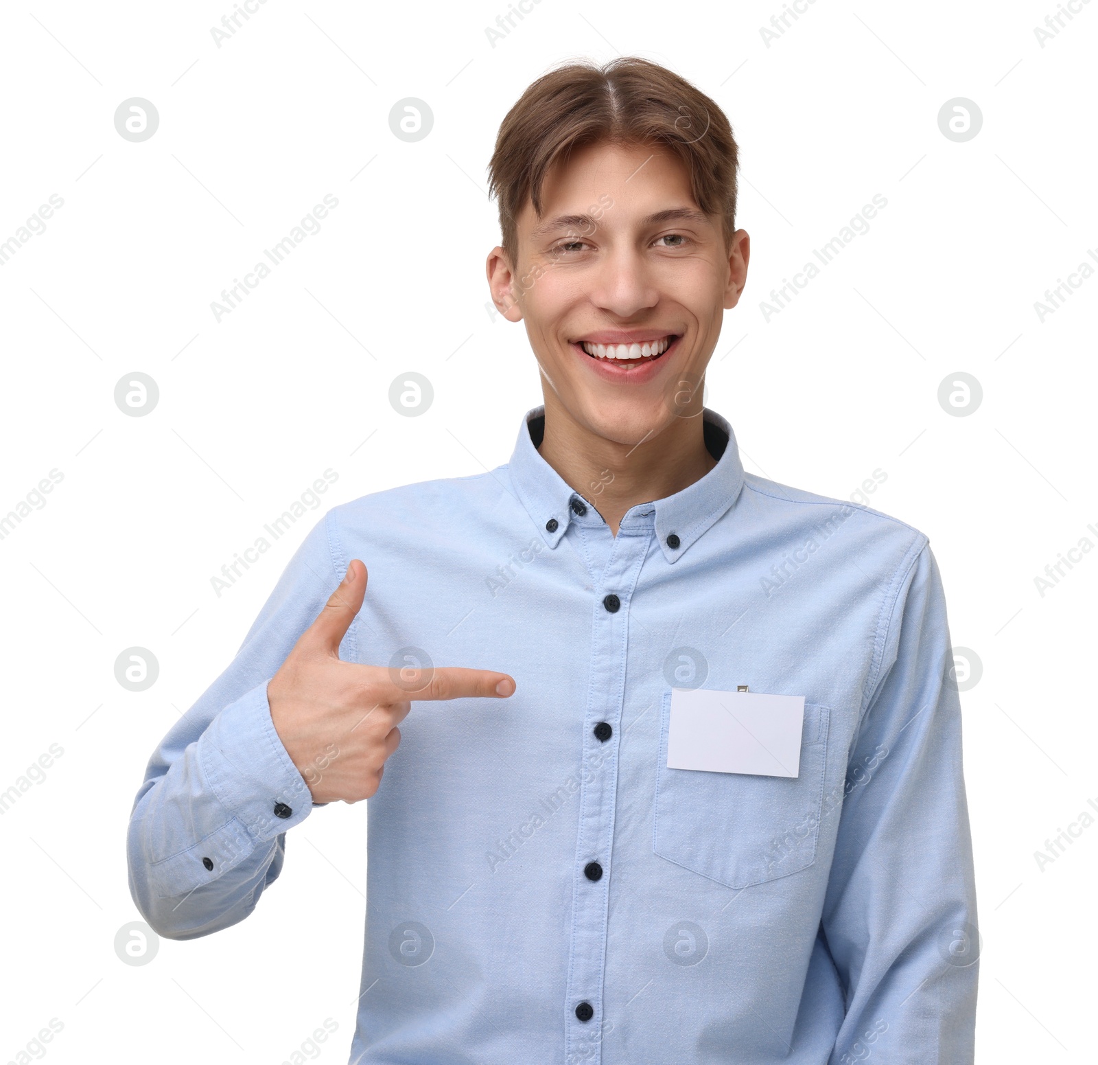 Photo of Happy man pointing at blank badge on white background