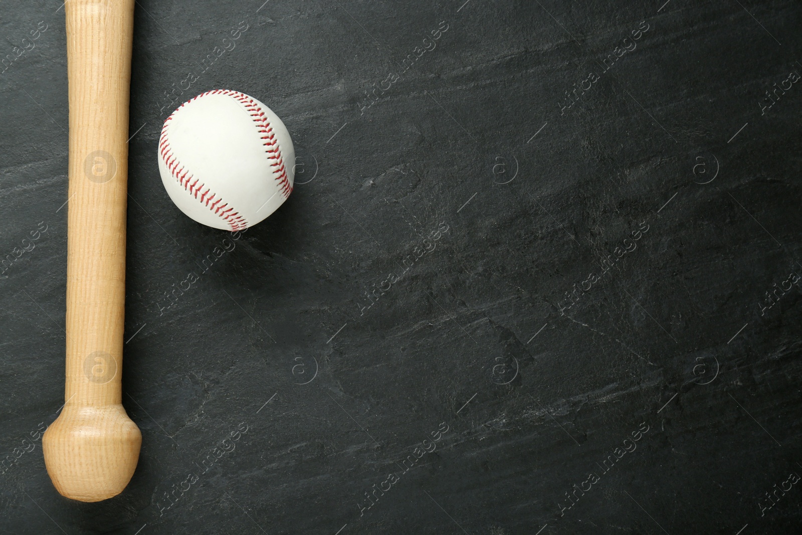 Photo of Baseball bat and ball on black background, top view with space for text. Sports equipment