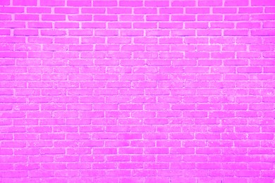 Image of Texture of bright fuchsia color brick wall as background