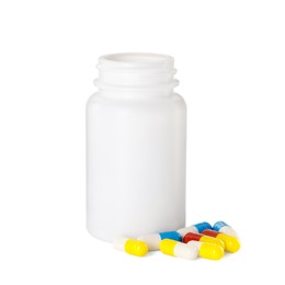 Photo of Antibiotic pills and bottle isolated on white