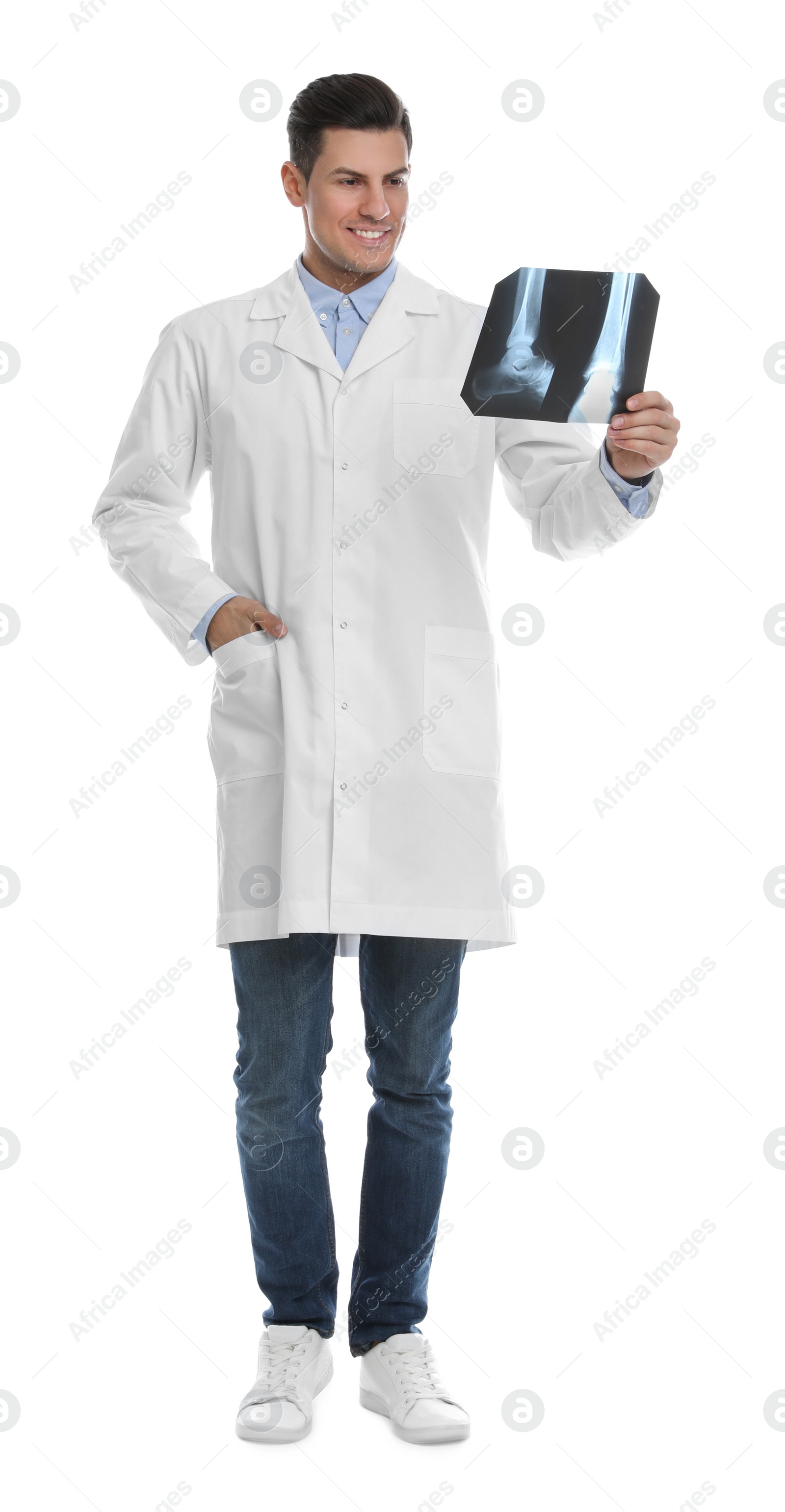 Photo of Orthopedist holding X-ray picture on white background