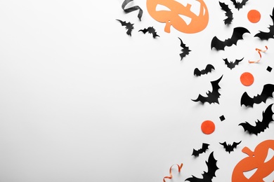 Halloween decor elements on white background, flat lay. Space for text