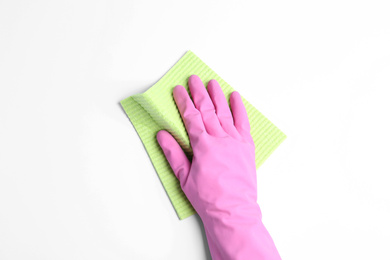 Photo of Person in rubber glove with rag on white background, closeup of hand