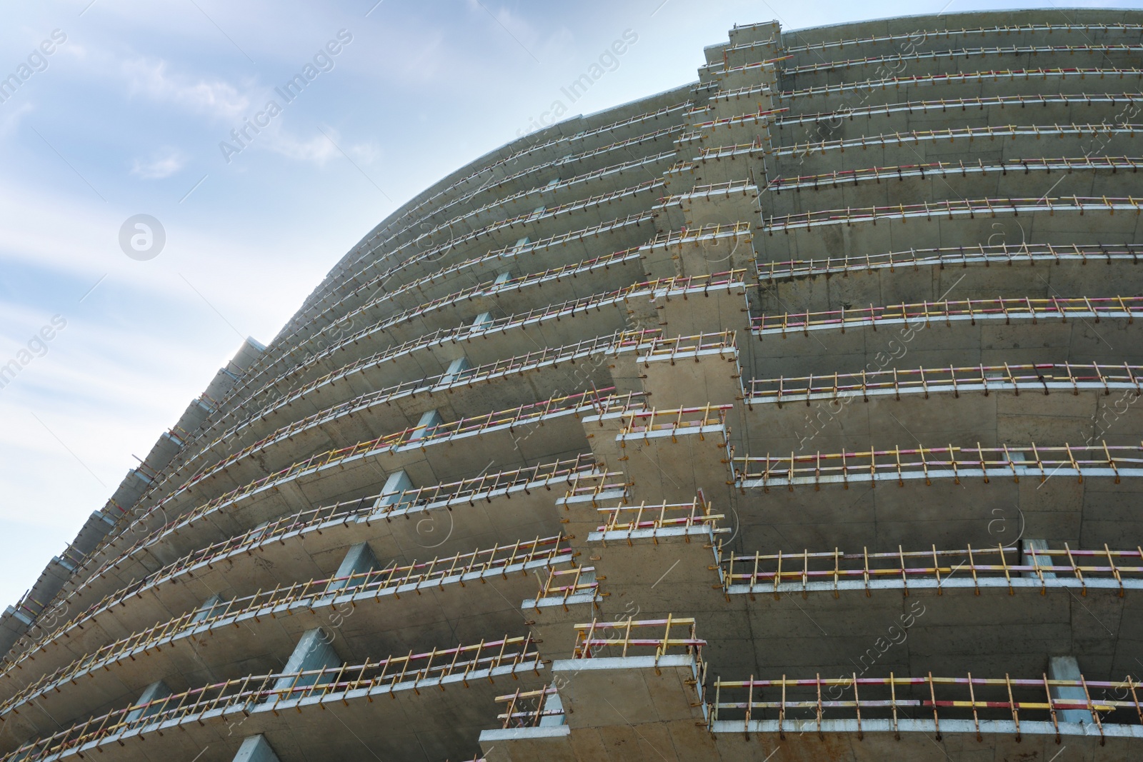 Photo of Construction site with unfinished building, low angle view