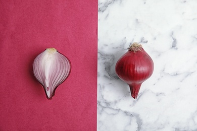 Photo of Beautiful composition with ripe red onions on color background