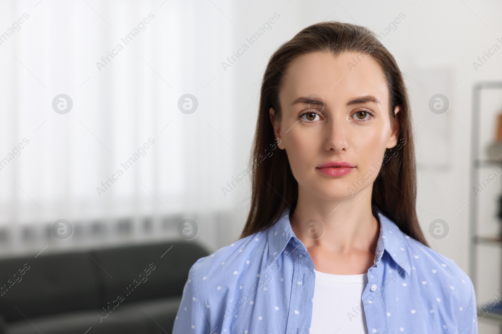 Photo of Portrait of beautiful woman indoors, space for text