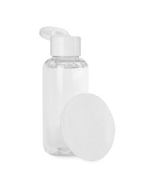 Photo of Bottle of micellar cleansing water and cotton pad isolated on white