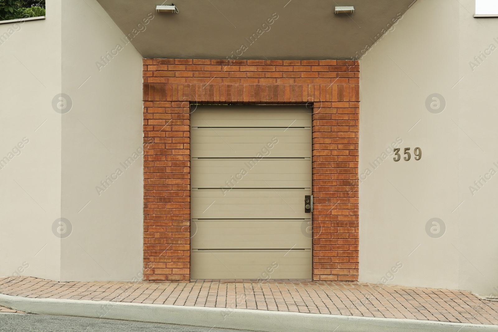 Photo of Beige wall with closed entrance door. Exterior design