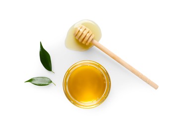 Tasty honey in glass jar, leaves and dipper on white background, flat lay