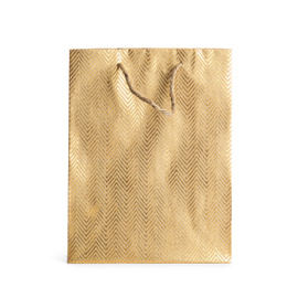 Photo of Golden paper shopping bag isolated on white. Space for design