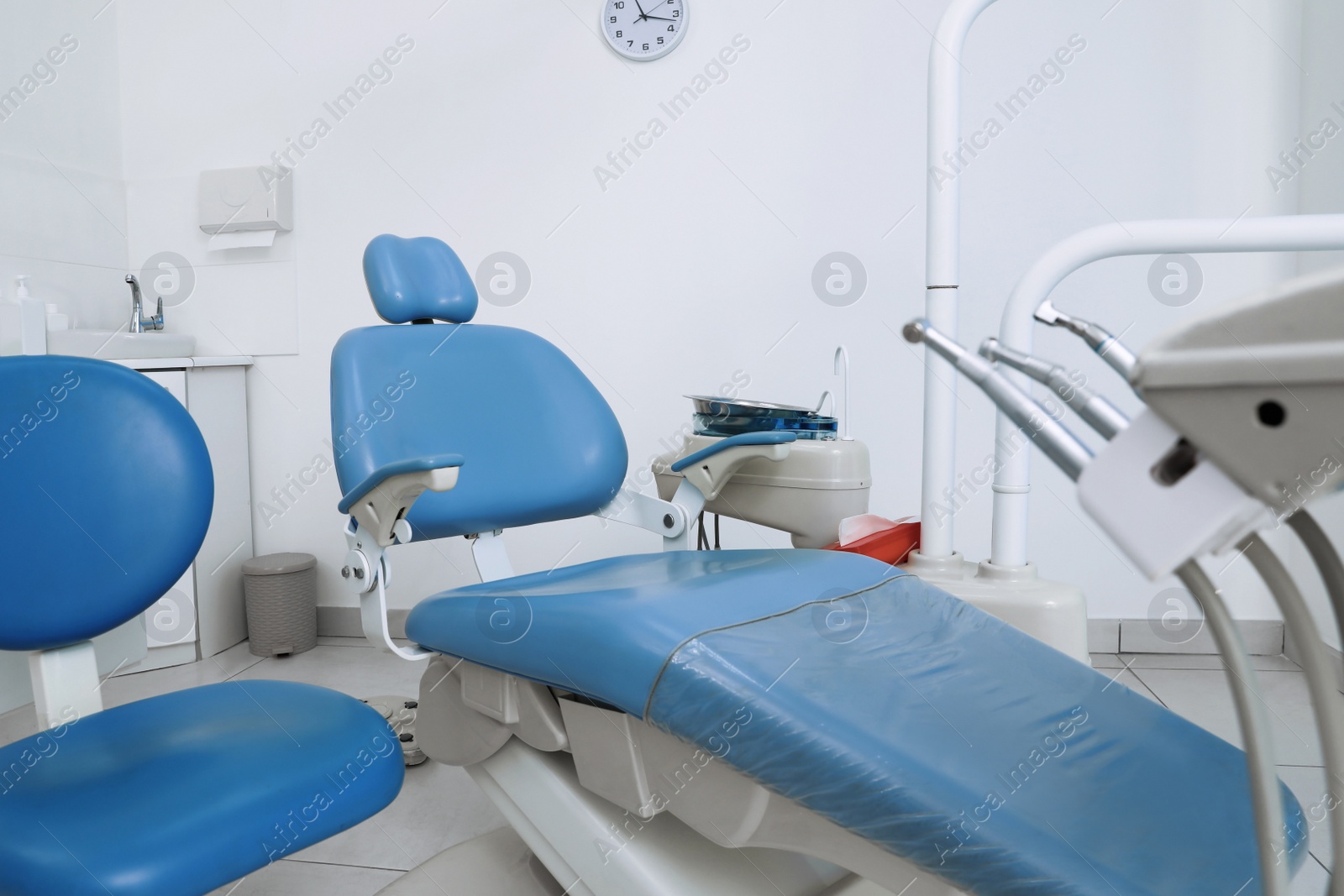 Photo of Dentist's office interior with chair and modern equipment