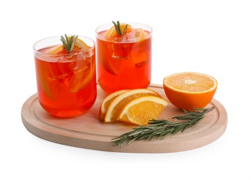 Photo of Aperol spritz cocktail in glasses, orange slices and rosemary isolated on white