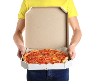 Young man with opened pizza box on white background. Food delivery service