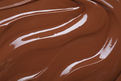 Tasty chocolate paste as background, closeup view