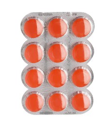 Photo of Blister with orange cough drops isolated on white
