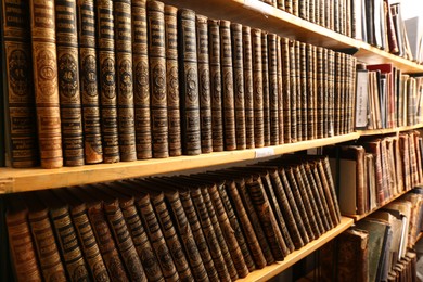 Photo of Collection of old books on shelves in library