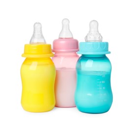 Photo of Feeding bottles with milk on white background