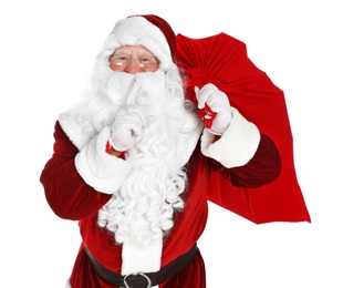 Photo of Authentic Santa Claus with bag full of gifts on white background