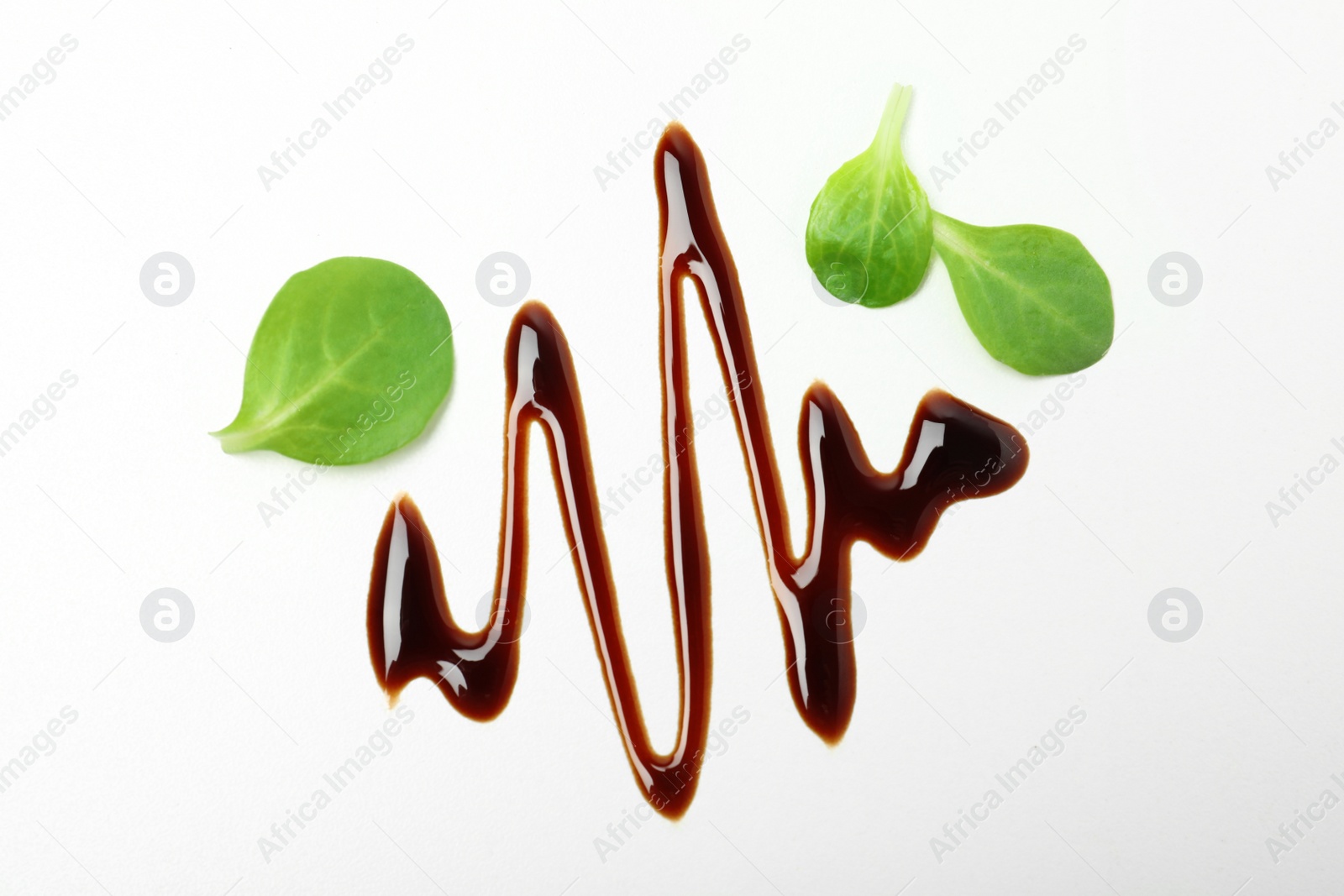 Photo of Composition with balsamic vinegar isolated on white, top view