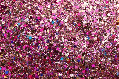 Photo of Shiny bright pink glitter as background, top view