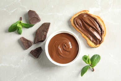 Photo of Flat lay composition with tasty chocolate mousse, bread and mint on table