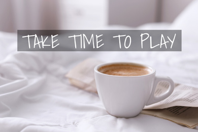 Image of Work-life balance concept. Morning coffee and newspaper on bed