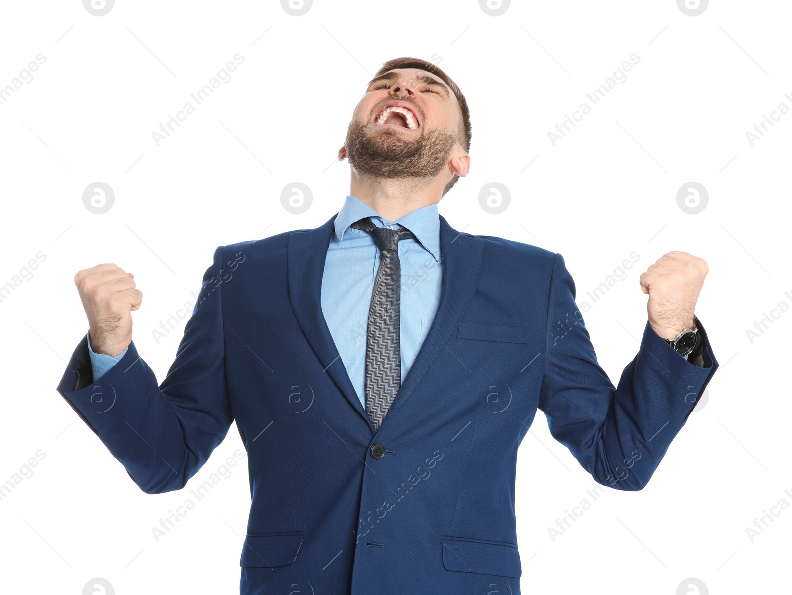Young businessman celebrating victory on white background Photo of Young businessman celebrating victory on white background