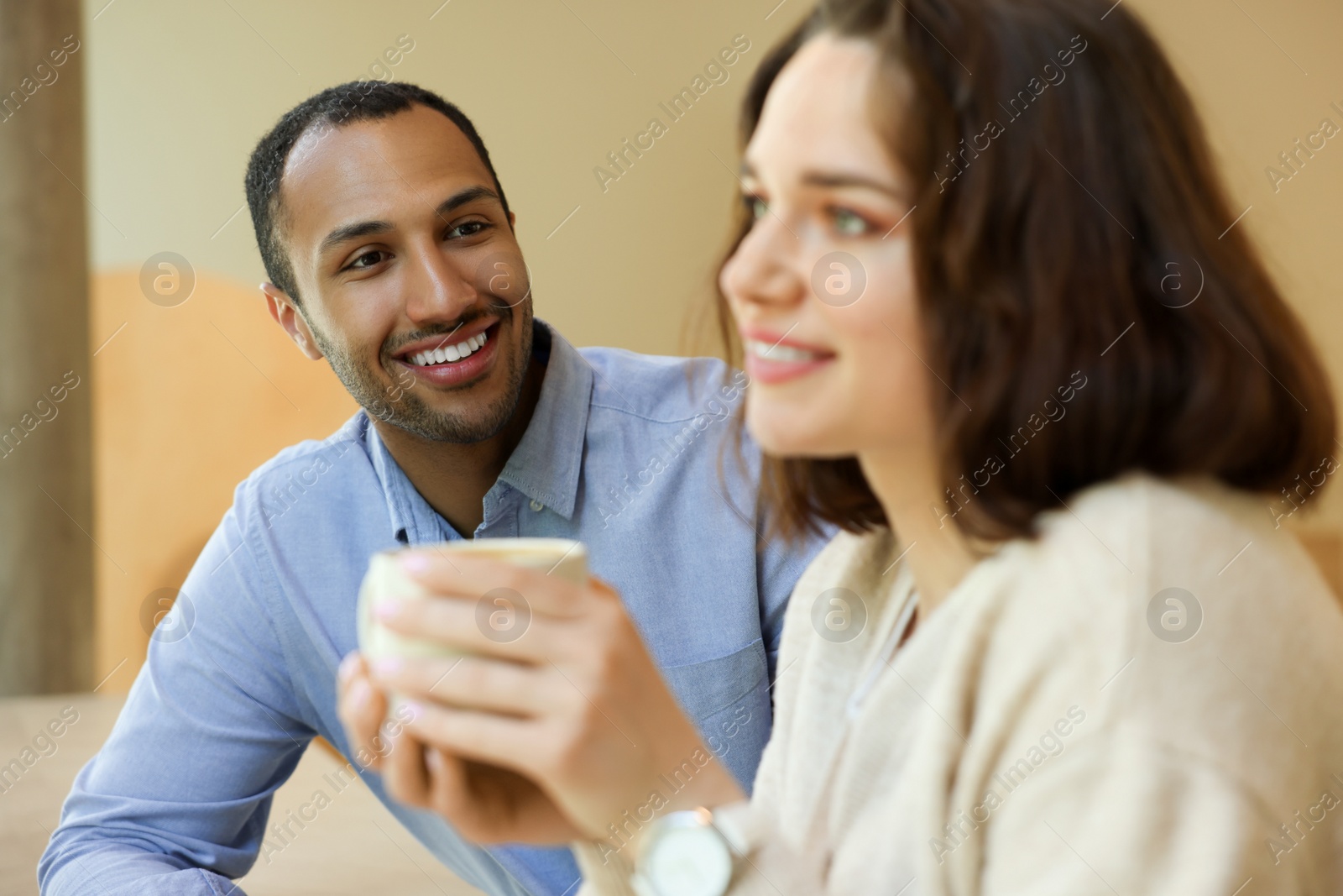 Photo of Romantic date. Happy couple spending time together in cafe