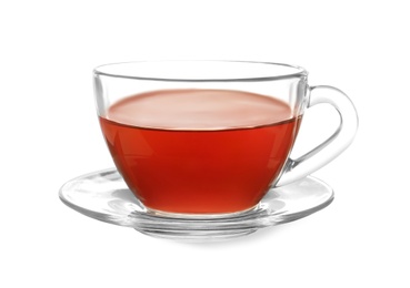 Photo of Glass cup of tea and saucer on white background