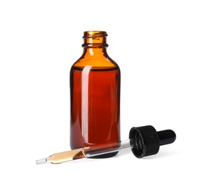 Photo of Cosmetic bottle and pipette with essential oil on white background