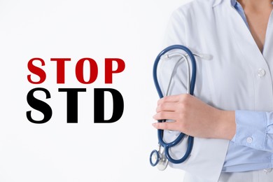 Image of STOP STD. Doctor with stethoscope on white background, closeup
