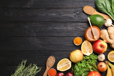 Photo of Flat lay composition with natural products and space for text on wooden background. Home remedies for asthma