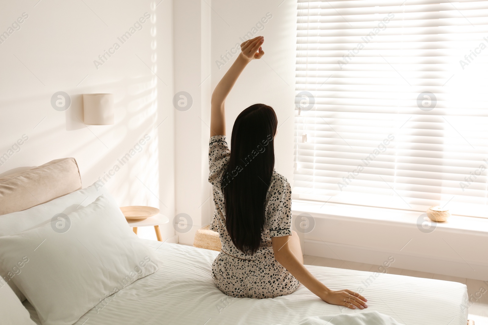 Photo of Young woman awakening at home. Lazy morning