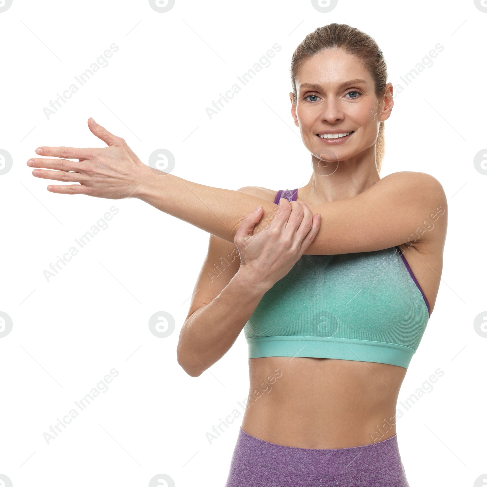 Photo of Portrait of sportswoman stretching on white background