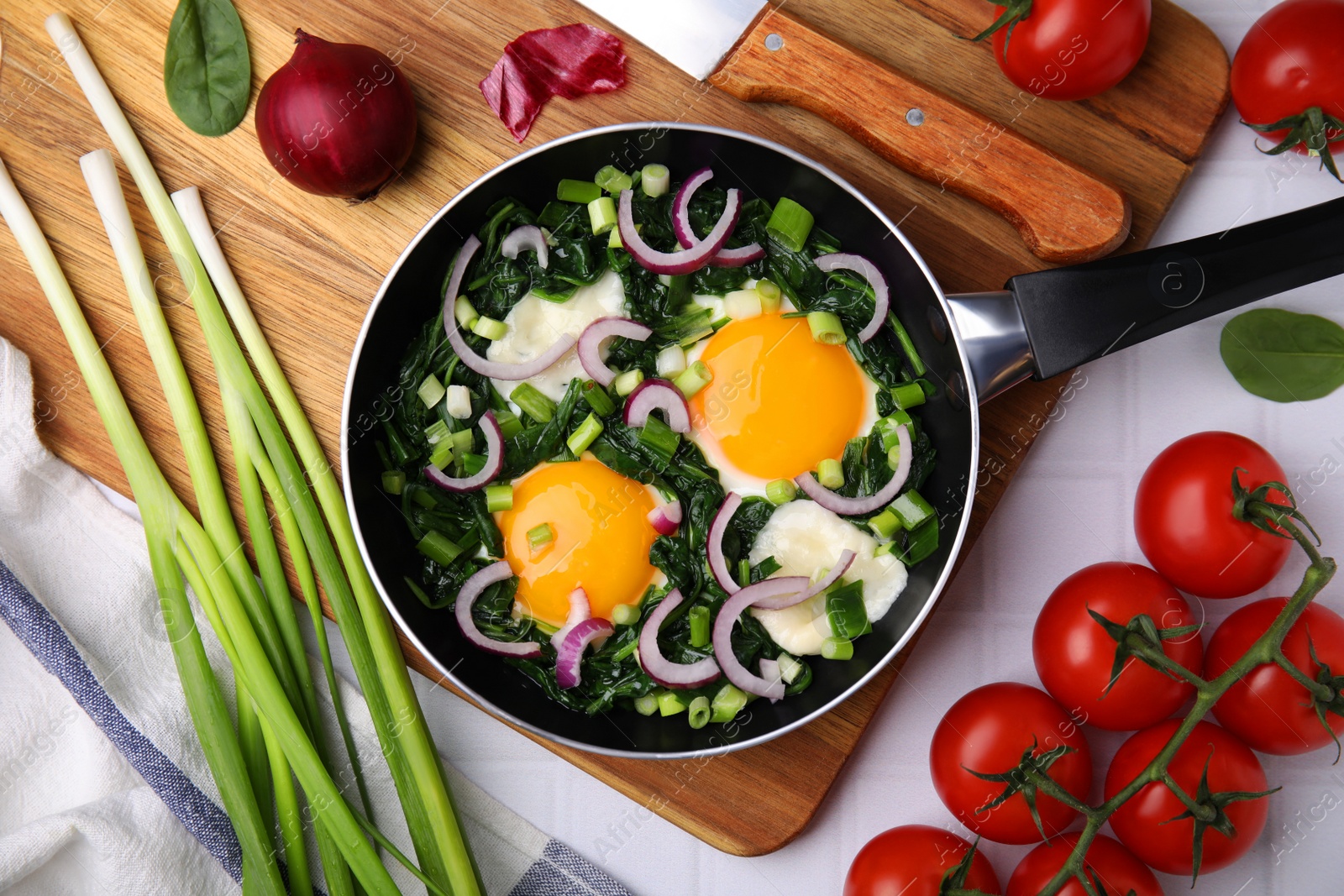 Photo of Flat lay composition with tasty Shakshouka and ingredients on white table