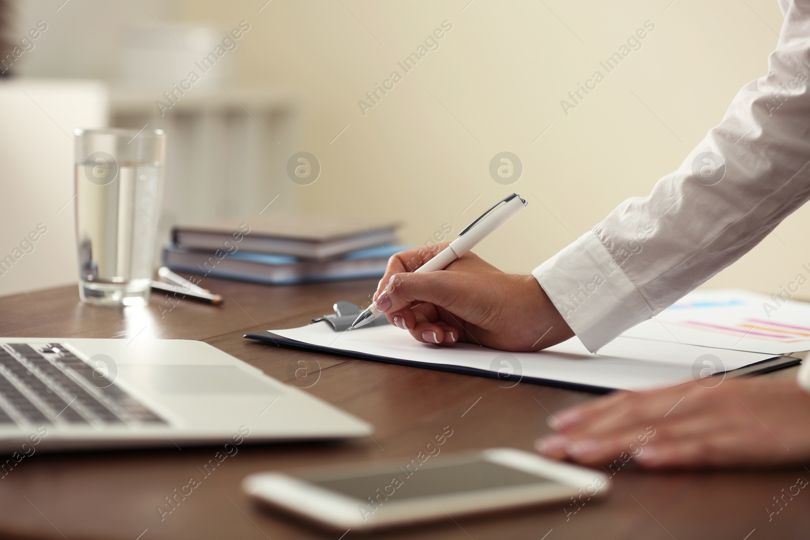 Photo of Business trainer working at table in office, closeup