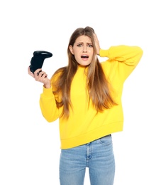 Emotional young woman playing video games with controller isolated on white