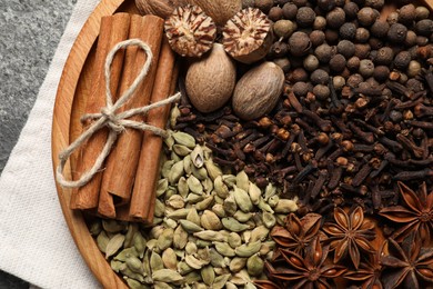 Different spices and nuts on table, top view