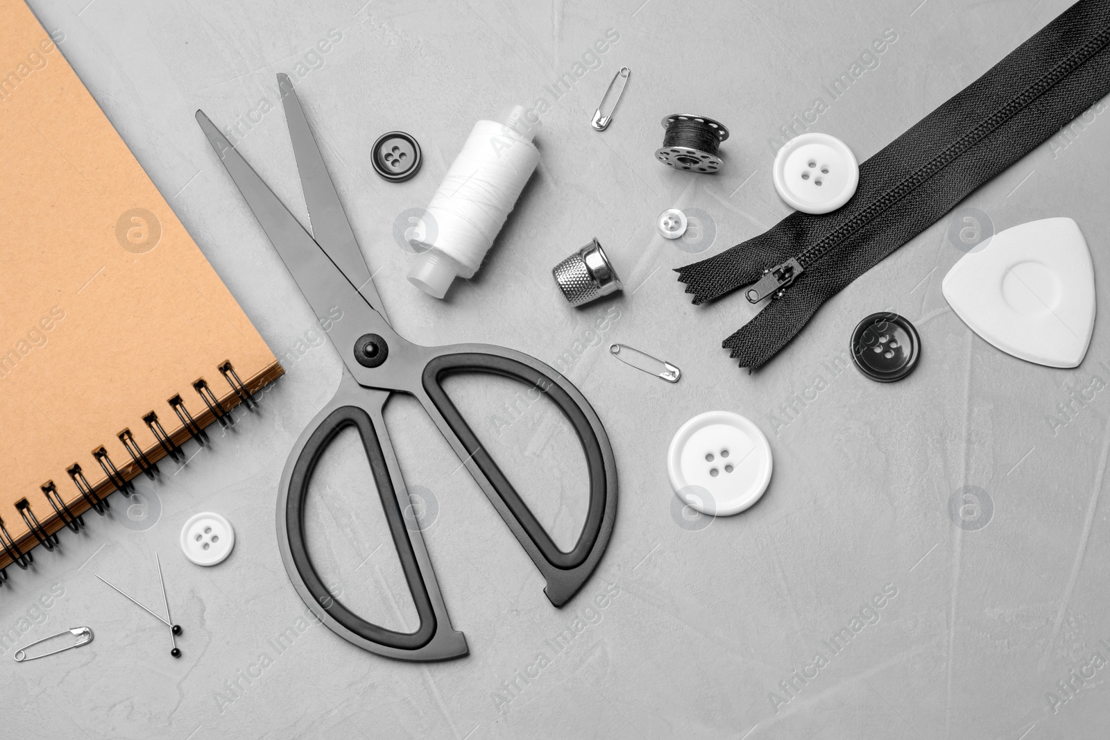 Photo of Flat lay composition with accessories for tailoring on table