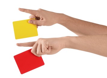 Photo of Referee holding cards and pointing on white background, closeup