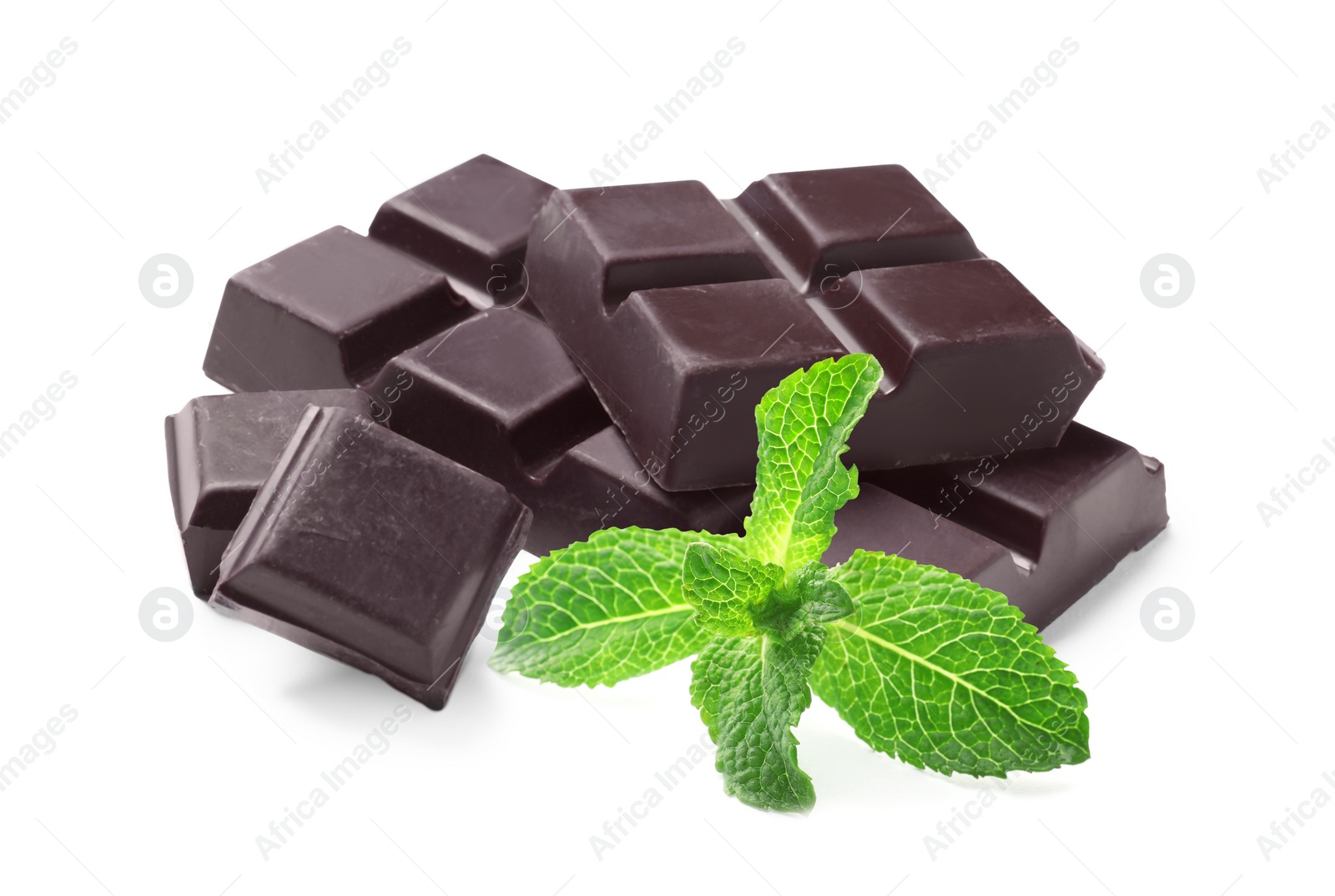 Image of Tasty dark chocolate pieces and mint on white background