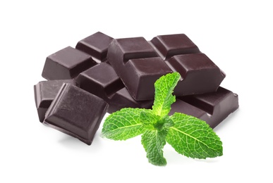 Image of Tasty dark chocolate pieces and mint on white background