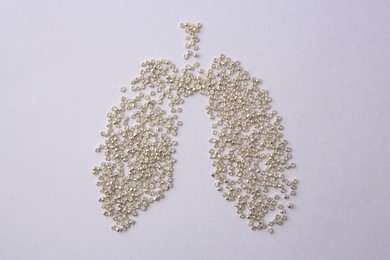 Photo of Human lungs made of beads on white background, flat lay