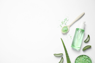 Photo of Flat lay composition with aloe vera and cosmetic products on white background