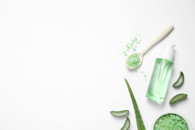 Flat lay composition with aloe vera and cosmetic products on white background