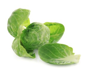 Photo of Fresh green brussels sprout and leaves on white background