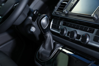 Photo of Gearshift and dashboard inside of modern car