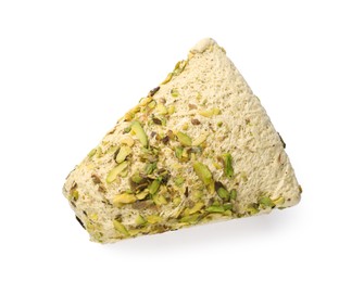 Photo of Piece of tasty halva with pistachios isolated on white, top view