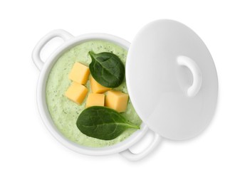 Photo of Delicious spinach cream soup with cheese in bowl isolated on white, top view